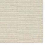 Detailed close-up of cream wool ribbed texture and natural variation