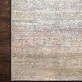 Close-up overhead shot of Lucia Mist Rug corner revealing detailed weave texture and color variations on wood floor