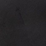 Close-up texture of matte black ceramic surface showing fine grain and soft matte finish