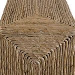 Close-up showing detailed woven texture and intricate concentric pattern on the table edge