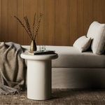 Zach End Table in living room setting with golden vase holding branches, atop the table beside a beige sofa