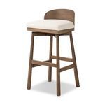 Cloris stool shown from 45-degree front angle highlighting seat depth and wood grain on legs
