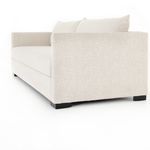 Side-back angle showing thick armrest and textured upholstery of sofa bed