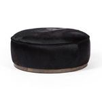 Side view emphasizing the smooth rounded profile of the ottoman