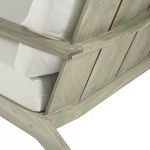 Close-up detail of joint where armrest meets angled backrest of teak frame