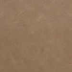 Seam detail with visible tonal stitching running along center of leather cushion