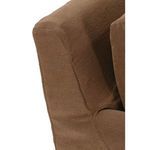 Close-up showing smooth slipcover texture and curved side arm shaping on sofa