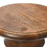 Close-up detail of the brown walnut wood grain and smooth edge on tabletop of end table