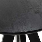 Close-up of black angled wood legs with smooth matte finish