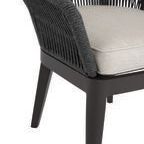 Close-up showcasing chair's rope texture and smooth beige fabric cushion edges