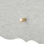 Close-up of drawer knob in wood and metal combination on cerused oak textured drawer front