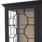 Close-up angled view of top corner with black metal honeycomb grid over glass and wood interior visible.