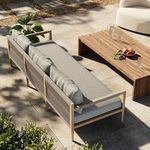 Overhead diagonal perspective with oak coffee table and garden elements on patio