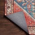 Detailed close-up of Layla Marine / Clay Rug corner highlighting worn vintage-inspired motif and colors