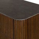 Close view of bluestone tabletop surface emphasizing fine texture with dark and subtle mineral tones.