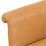 Butterscotch chair placed in living room setting near wooden stump side table