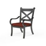 Monterey Dining Chair with curved armrests, cross-back design, dark aluminum frame, and rust-colored cushion