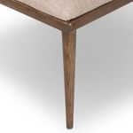 Close-up of tapered wooden leg showing wood grain and smooth finish