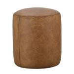 Round Cleo Leather Ottoman in warm brown with smooth, gently textured surface and subtle seam detail