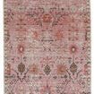 Oriental pink rug with faded lilac, gold, and brown floral patterns inspired by traditional Turkish textiles