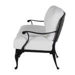 Side profile showing the sofa’s cushioned seating depth and smooth black arm supporting cushions