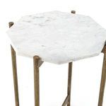 Low angle emphasizing the clean lines of the solid brass base and marble top of the Adair table