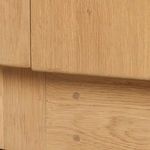 Close-up of wood joinery and dowel pins on base of sideboard