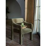 Elise Dining Chair in an interior corner near window with daylight, arm curved and brown fabric
