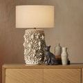 Close-up of Margot chest top with table lamp and decorative vases