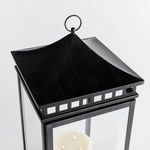 Close-up angled view highlighting the lantern's black sweeping top with hanging ring