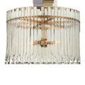 Side profile of Electra Chandelier showing density of vertical glass bars held by antique brass metal frame