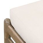 Close view of the chaise's smooth white cushion surface