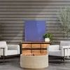 Outdoor setting with two Hearst Outdoor Chairs facing each other, centered around a round wicker coffee table