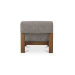 Back view focusing on chair’s foldover back upholstery above sturdy wooden legs