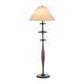 Floor lamp turned on with beige tapered shade isolated on white background