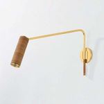 Narragansett Wall Sconce with aged brass finish and cylindrical rattan-wrapped shade on an elongated swing arm