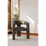 Elo Chair in a sunlit room corner on textured rug with wood framed window