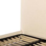 Close-up of headboard linen upholstery from side angle showing smooth fabric finish