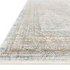 Low angle side view highlighting the rug’s luxurious smooth texture and layered border pattern