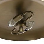Close-up of underside showing dual bulbs and aged brass shade interior