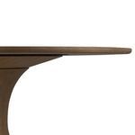 Side profile showing thin rounded tabletop edge and smooth curve of pedestal base.