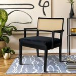 Bramblewood Arm Chair styled in living room with rug, abstract wall art, plants, and accessories.