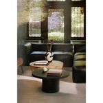 Aulo Coffee Table styled in living room with dark leather sectional and decorative books and vase