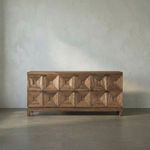 Dark walnut 6-drawer console table with faceted pyramidal drawer fronts and minimal brass pulls on a defined base