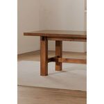 Partial side view with table on a light rug in a softly lit dining room setting