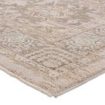 Close-up corner view showing plush pile and muted beige and gray pattern with a soft texture