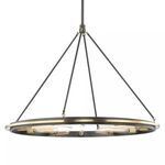 Circular 12-light pendant with a metal band and offset ring, vintage-style rods, and inward-facing tubular bulbs in a dark...