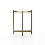 Perspective of Adair table highlighting marble top’s crisp edges and raw brass frame
