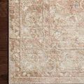Detailed corner of rug highlighting its textured pattern and craftsmanship on hardwood flooring