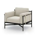 Hearst Outdoor Chair angled left, displaying plush armrest cushions and ivory strapping on side